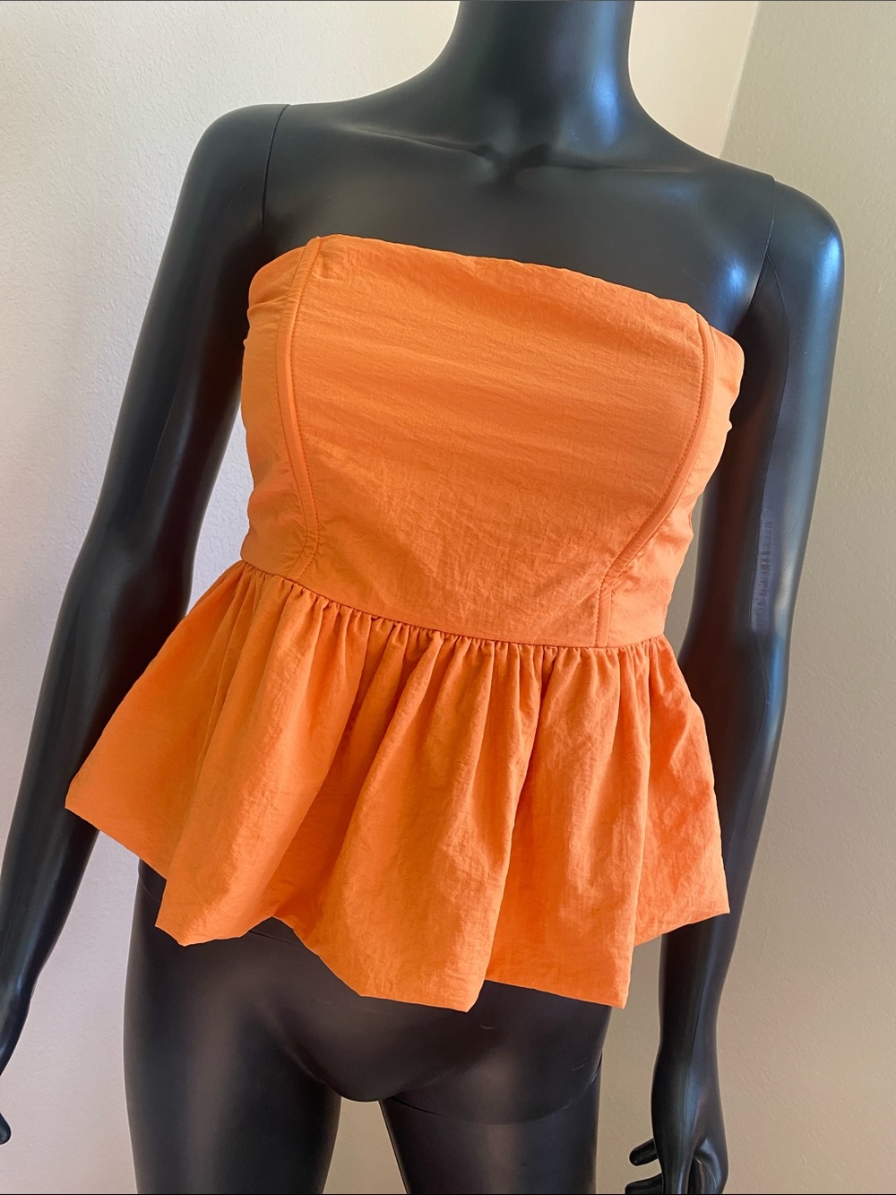 Evolutionary Strapless Peplum Top in Vibrant Orange